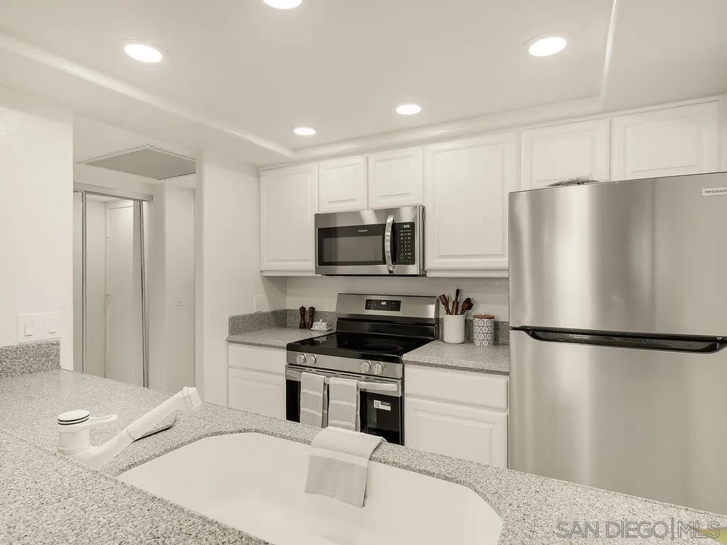 3634 7th Avenue, Unit 4B San Diego, CA 92103 - Photo 10 of 50 a kitchen with a refrigerator stove and microwave