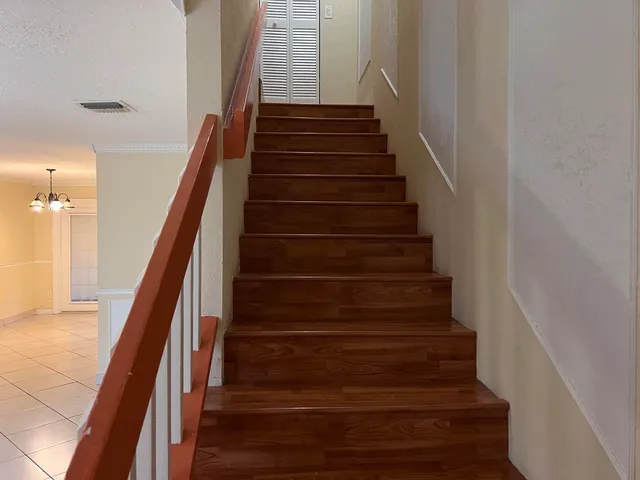 a bathroom with a sink and glass door