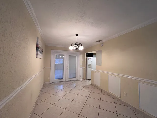 a kitchen with cabinets and white appliances