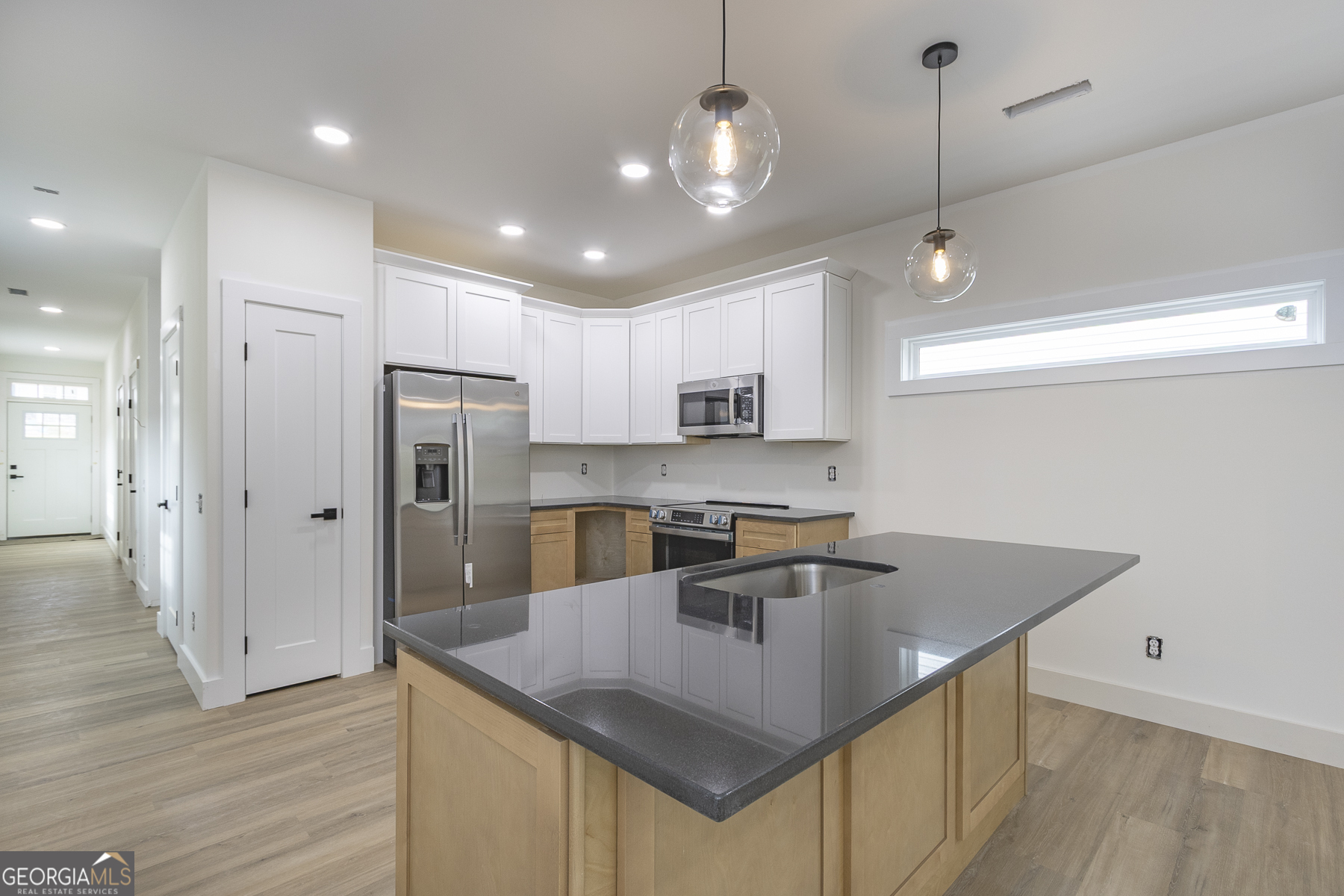 320 Thompson Street Pendleton, SC 29670 - Photo 2 of 7 a kitchen with stainless steel appliances granite countertop a sink a refrigerator and a stove top oven