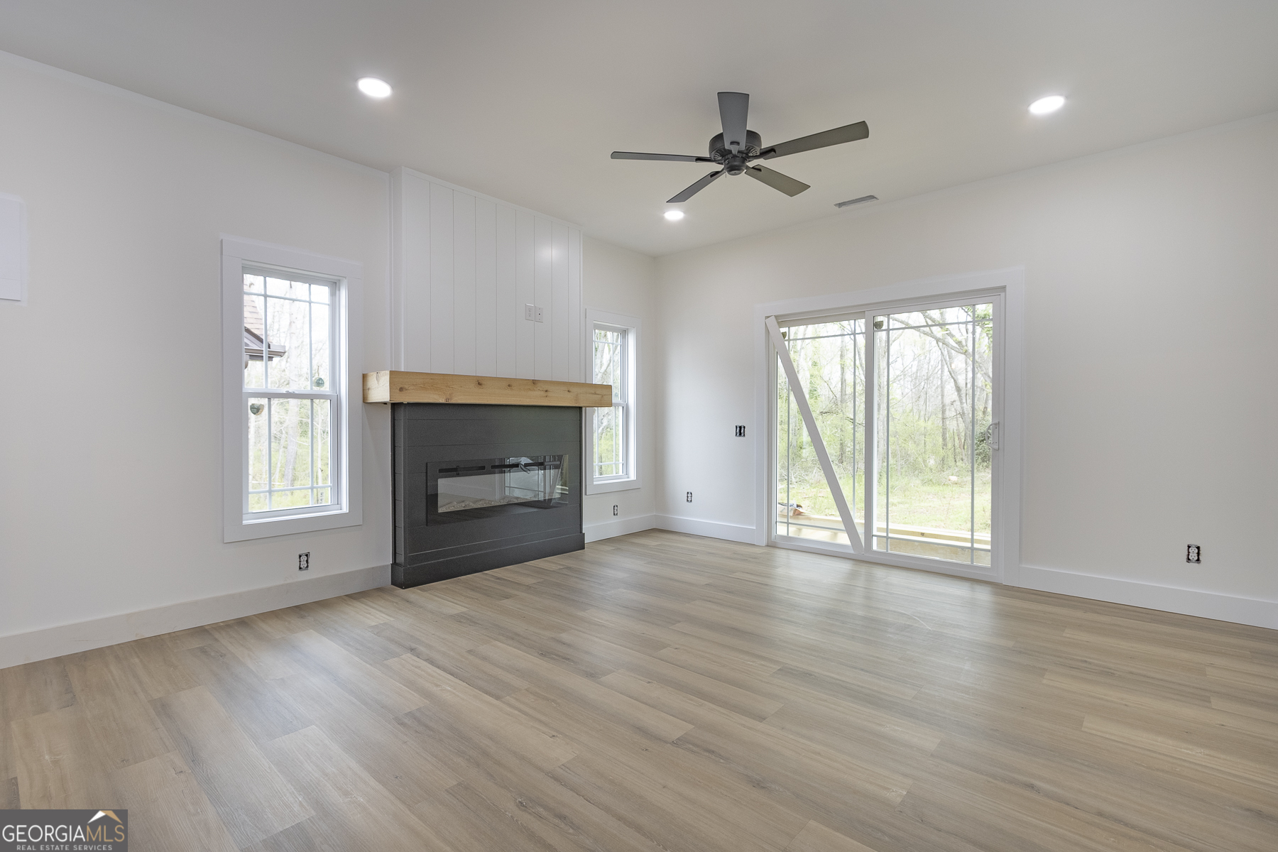 320 Thompson Street Pendleton, SC 29670 - Photo 5 of 7 a view of an empty room with a fireplace and a window