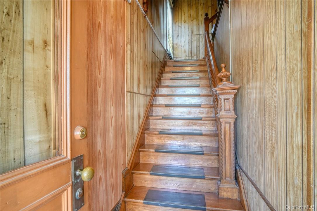 32 Balding Avenue Poughkeepsie, NY 12601 - Photo 14 of 39 Staircase with wooden walls