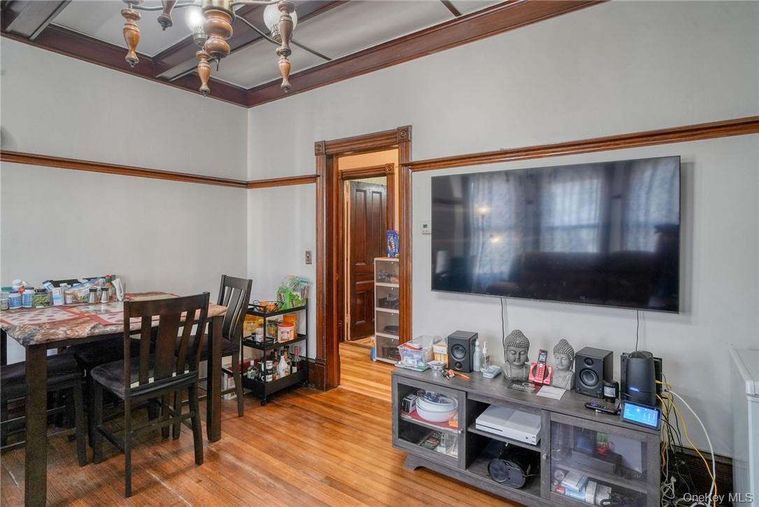 32 Balding Avenue Poughkeepsie, NY 12601 - Photo 7 of 39 Dining area with ornamental molding, light hardwood / wood-style flooring, and a chandelier