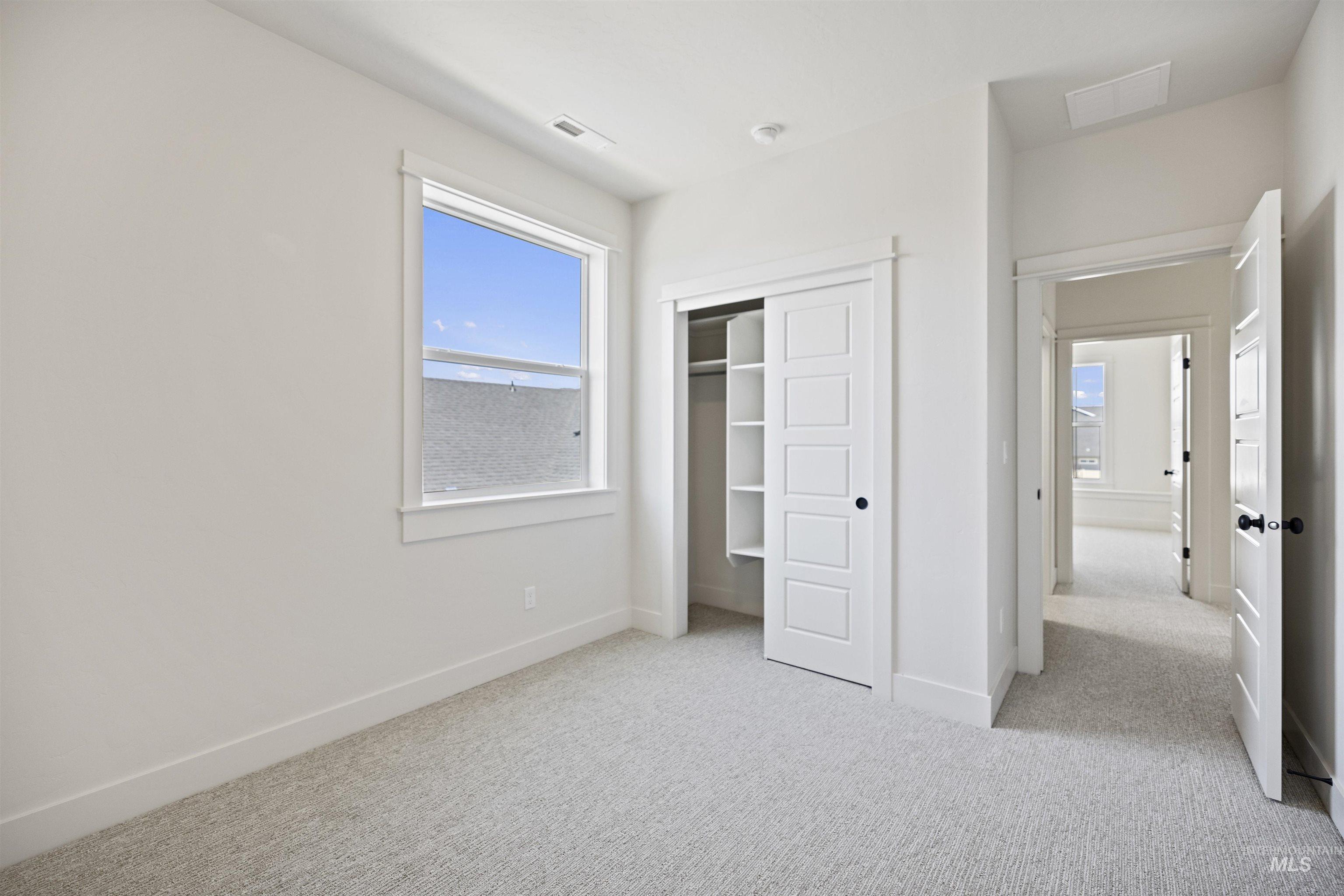 3515 South El Rio Avenue Boise, ID 83709 - Photo 25 of 47 Unfurnished bedroom featuring carpet floors and a closet