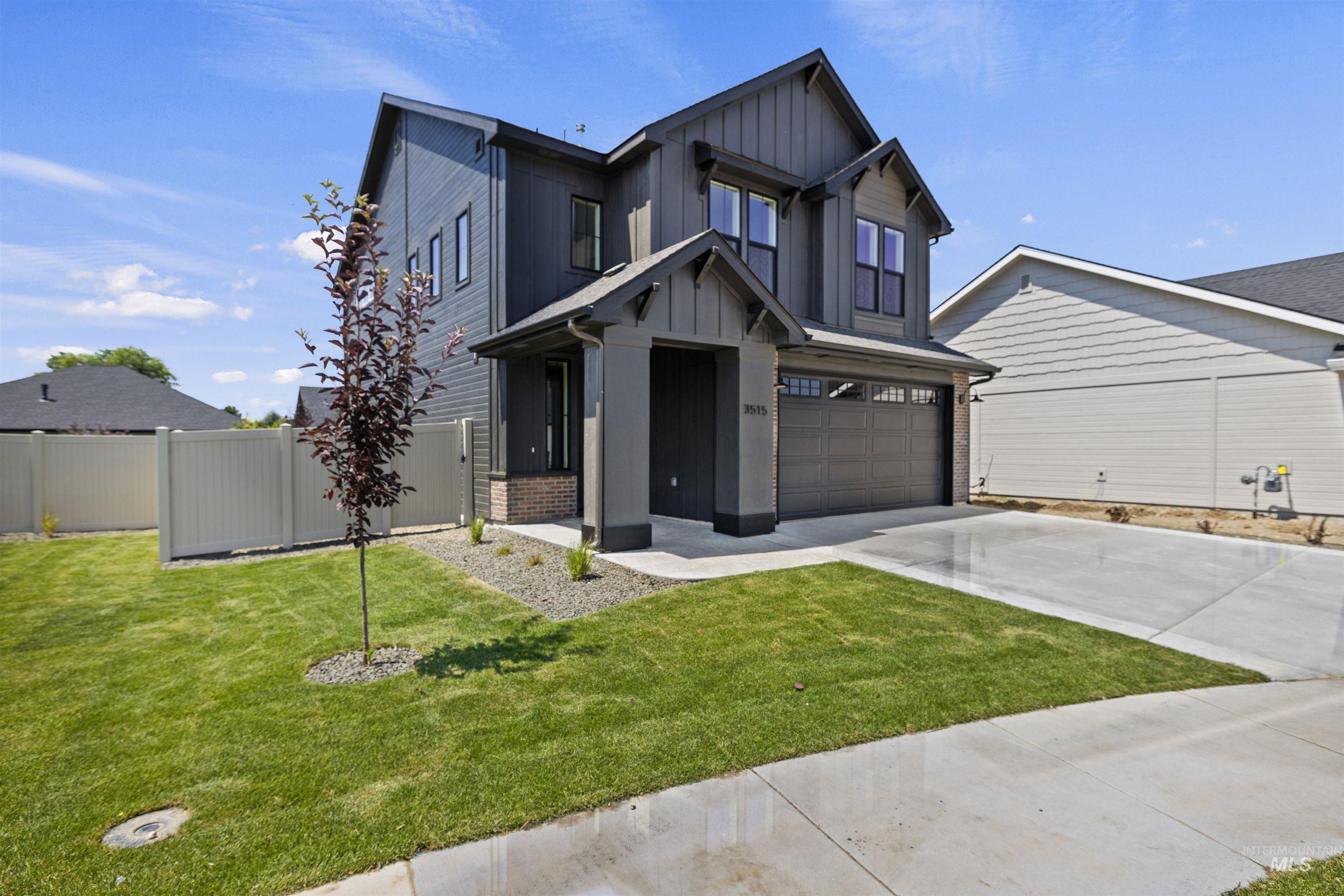 3515 South El Rio Avenue Boise, ID 83709 - Photo 3 of 47 View of front of house featuring driveway, board and batten siding, and a garage