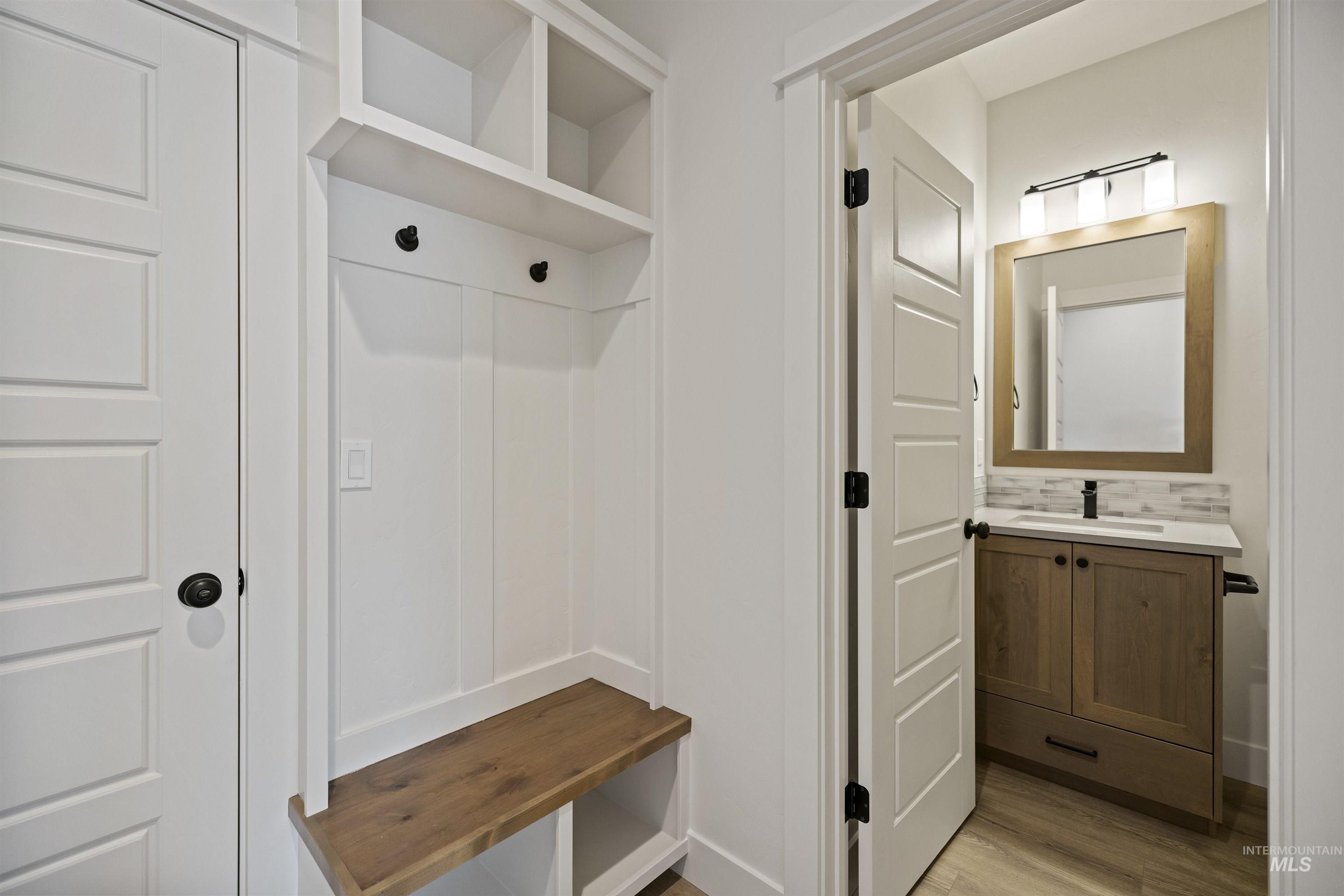3515 South El Rio Avenue Boise, ID 83709 - Photo 33 of 47 Mudroom with light wood-style flooring and a sink