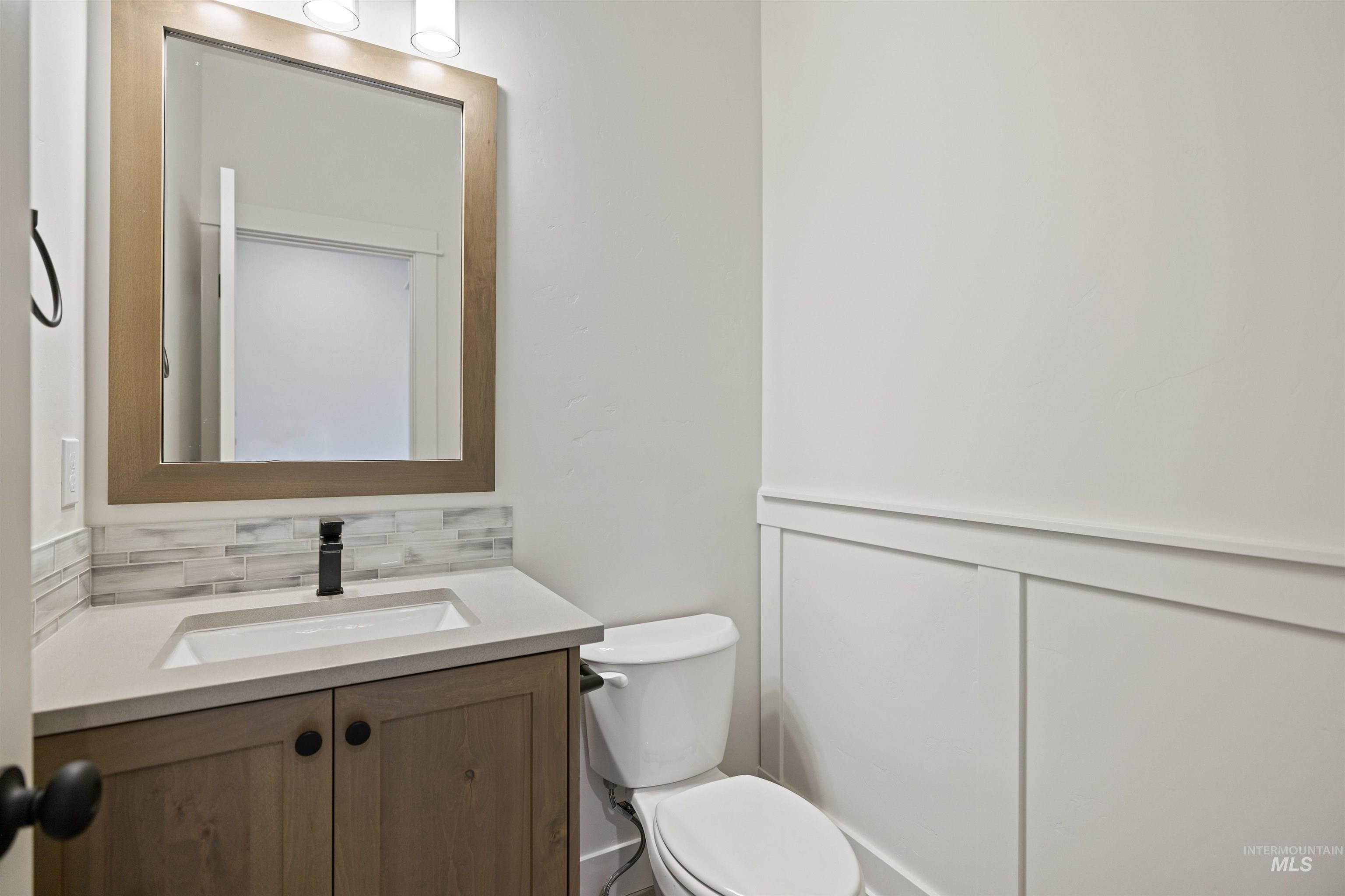 3515 South El Rio Avenue Boise, ID 83709 - Photo 34 of 47 Bathroom featuring vanity and decorative backsplash
