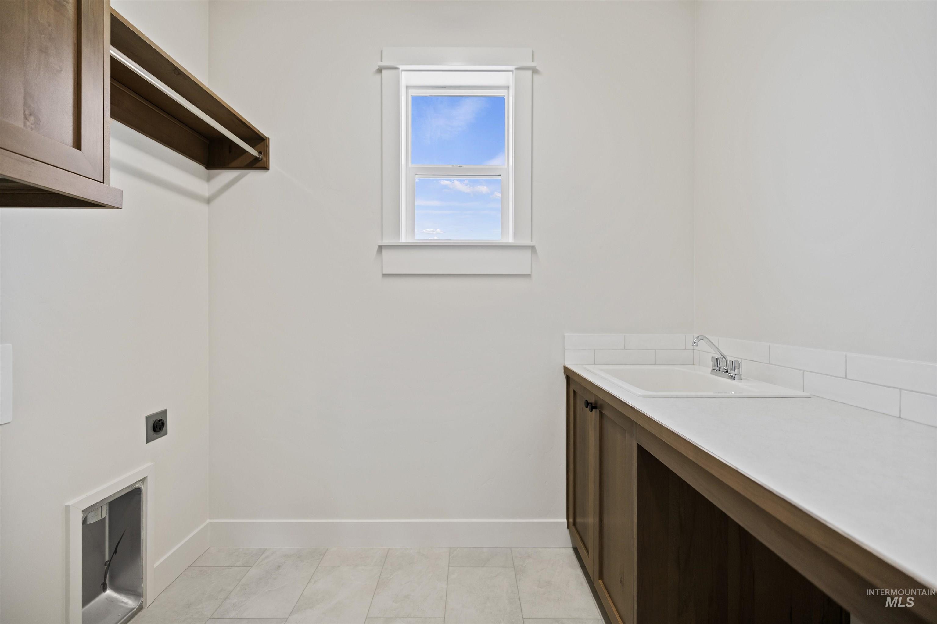 3515 South El Rio Avenue Boise, ID 83709 - Photo 37 of 47 Laundry area featuring hookup for an electric dryer and cabinet space