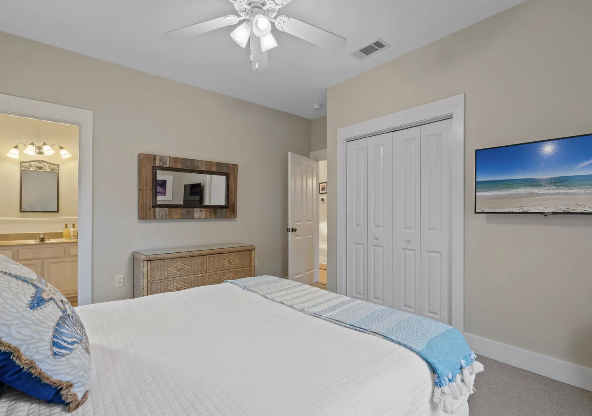 103 Cottage Way, Unit 13 Inlet Beach, FL 32461 - Photo 11 of 18 a bedroom with a bed and a chandelier