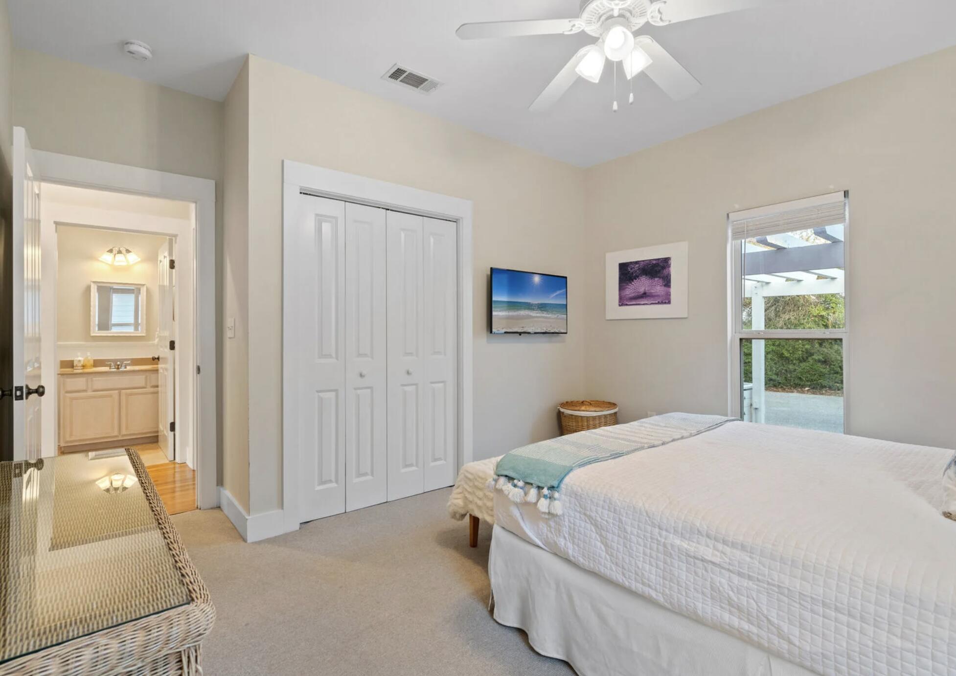 103 Cottage Way, Unit 13 Inlet Beach, FL 32461 - Photo 12 of 18 a bedroom with a bed and a chandelier