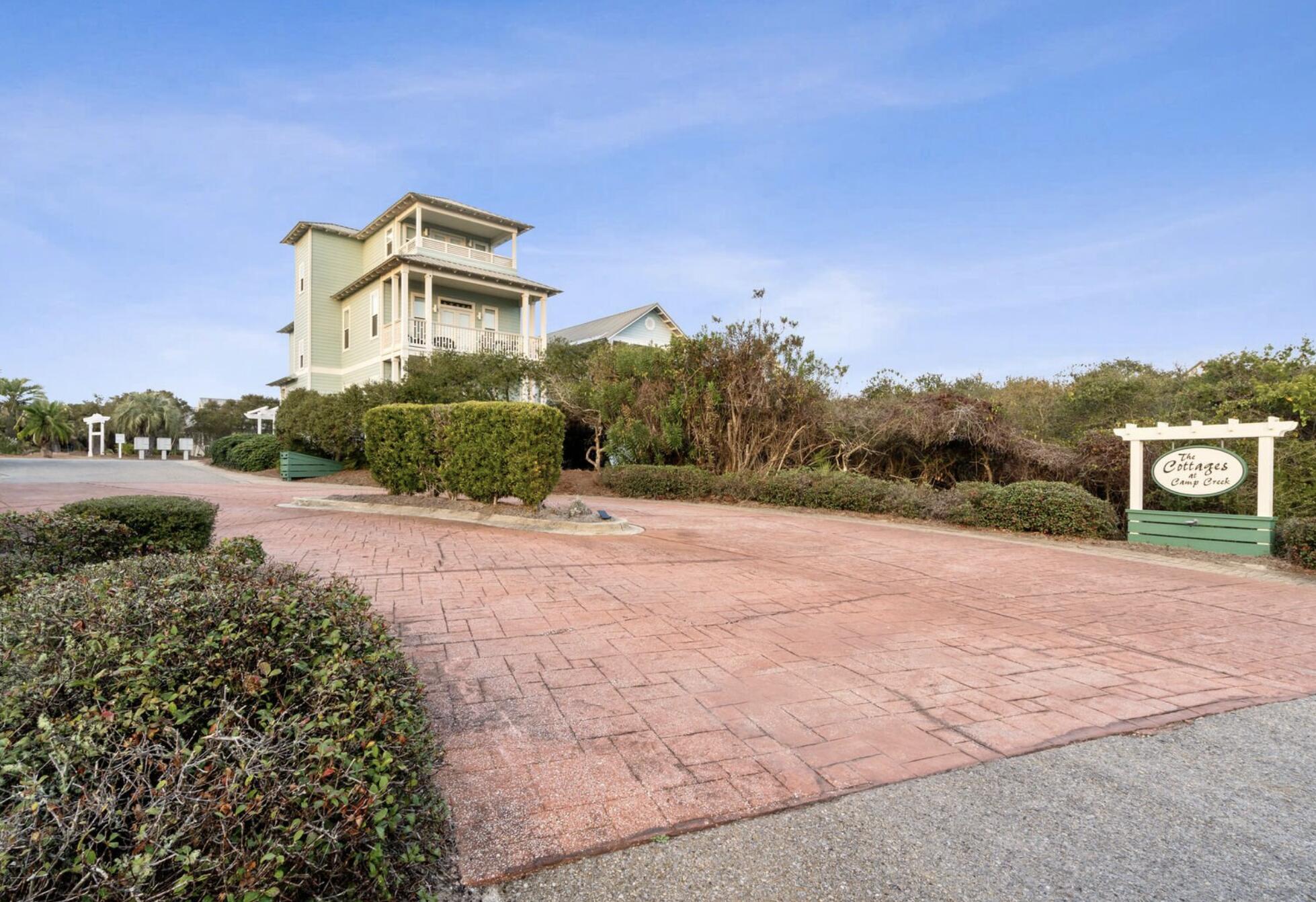 103 Cottage Way, Unit 13 Inlet Beach, FL 32461 - Photo 18 of 18 a front view of a house with a yard and garage