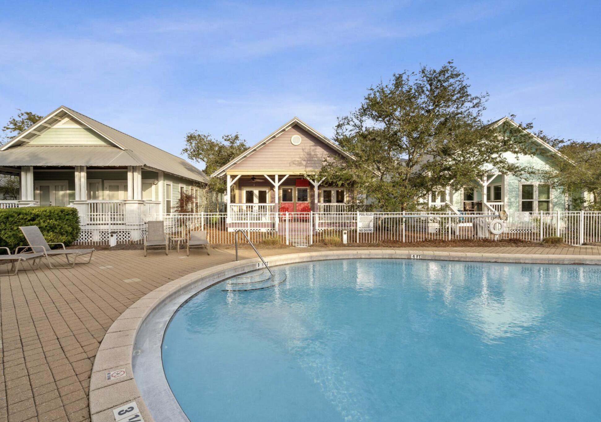 103 Cottage Way, Unit 13 Inlet Beach, FL 32461 - Photo 4 of 18 a view of a house with pool and deck