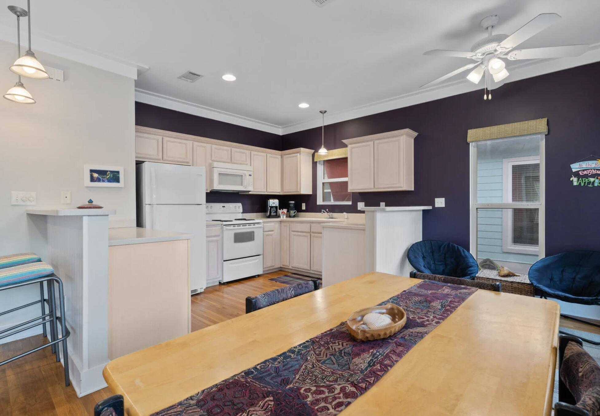 103 Cottage Way, Unit 13 Inlet Beach, FL 32461 - Photo 8 of 18 a kitchen with a refrigerator sink and cabinets