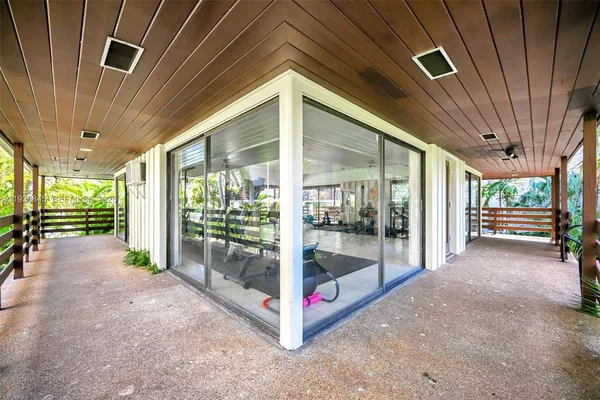 a lobby with furniture and floor to ceiling window