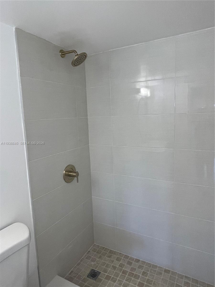 7483 Southwest 82nd Street, Unit A101 Miami, FL 33143 - Photo 28 of 39 a bathroom with a shower