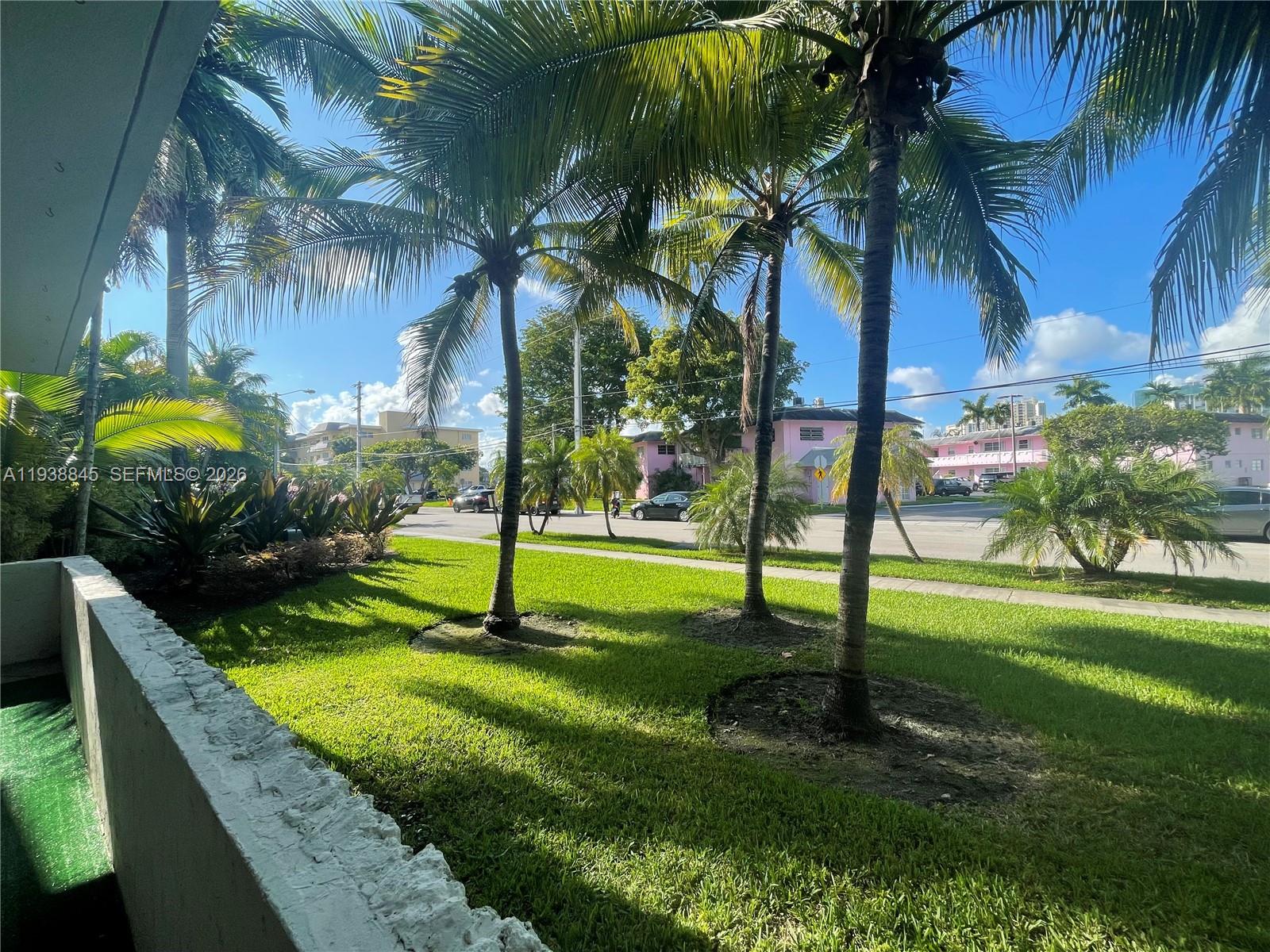 7483 Southwest 82nd Street, Unit A101 Miami, FL 33143 - Photo 38 of 39 a view of a park with palm trees