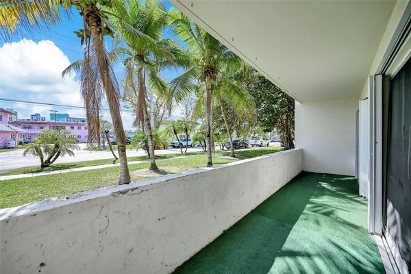 a view of a park with palm trees