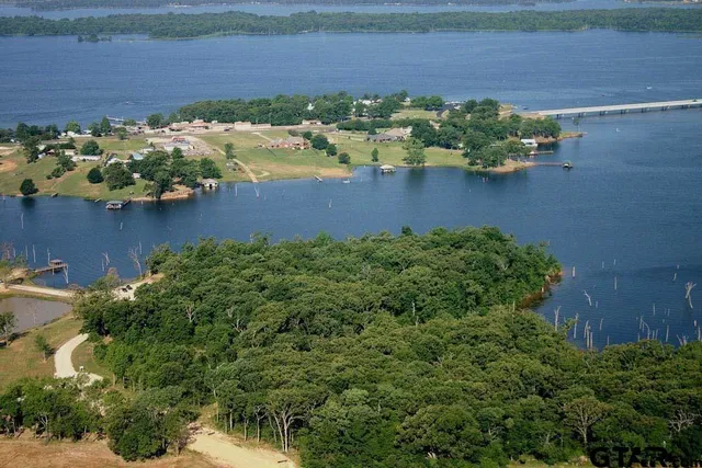 a view of a lake with a yard