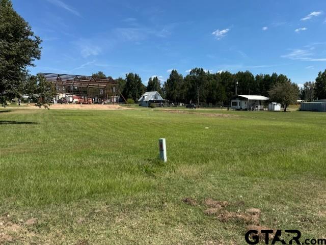 Lot 254-255 Choctaw & Kickapoo Quitman, TX 75783 - Photo 2 of 14 a swimming pool with wooden fence