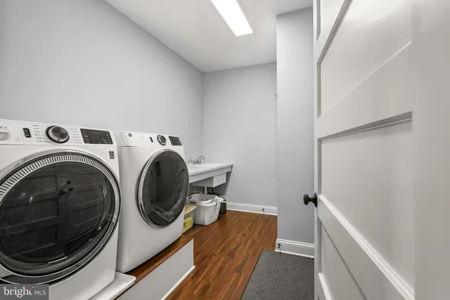 a view of a hallway with washer and dryer