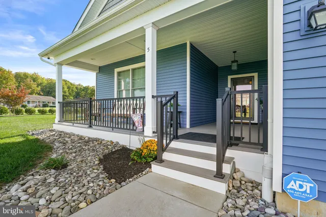 a front view of a house with a porch