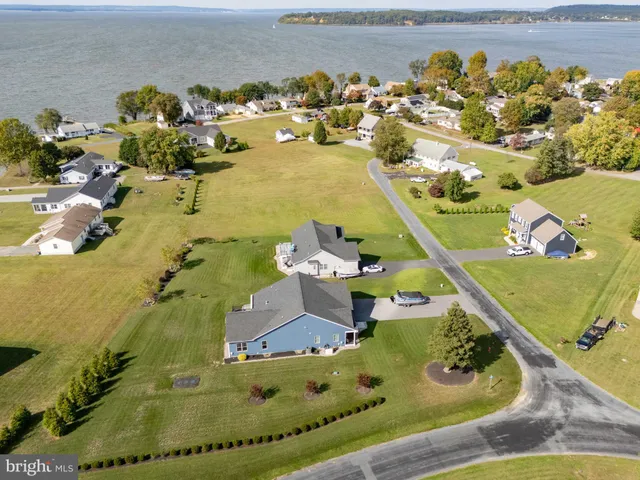 an aerial view of a house with a swimming pool