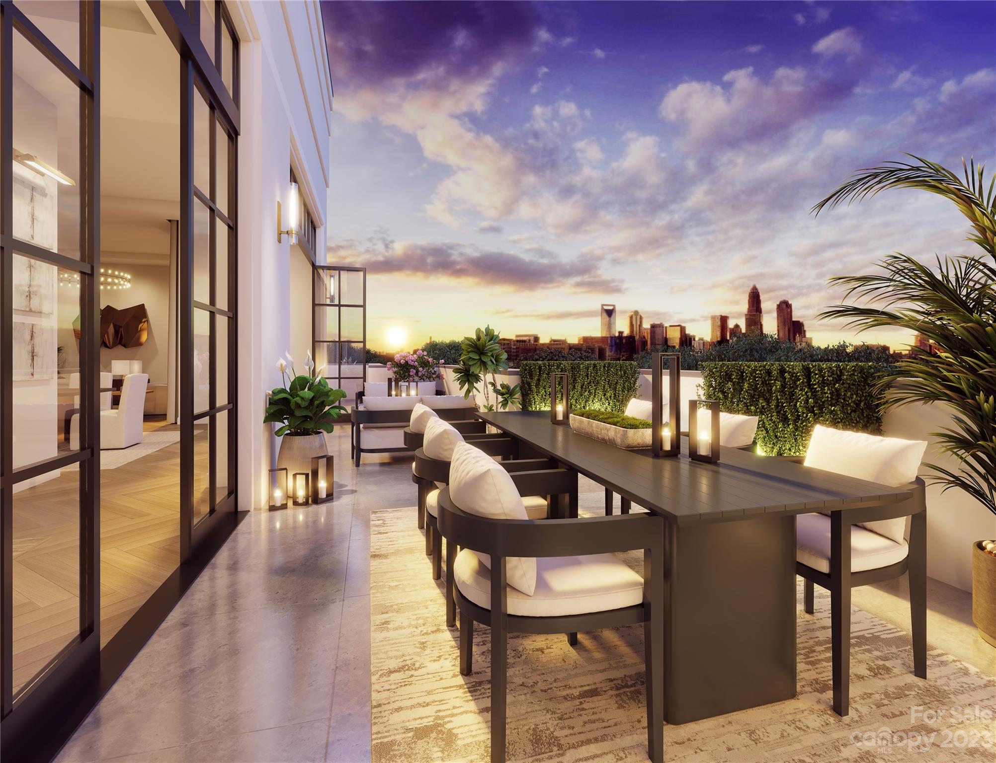 409 Queens Road, Unit 503 Charlotte, NC 28207 - Photo 3 of 4 a balcony with table and chairs