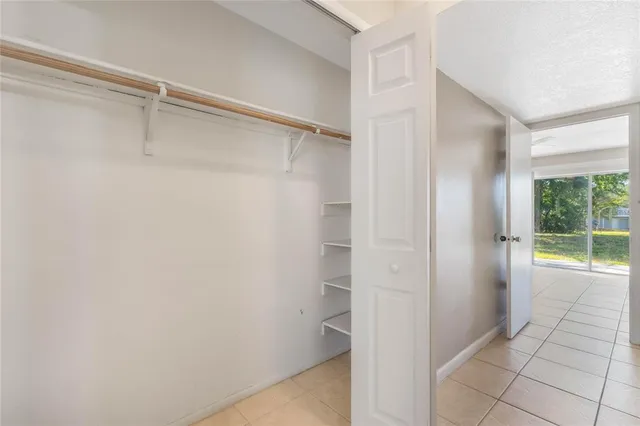 a bathroom with a shower and a window