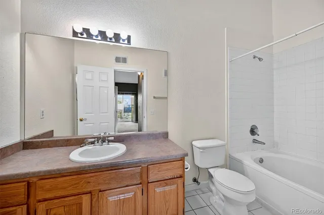 a bathroom with a sink toilet a mirror and shower