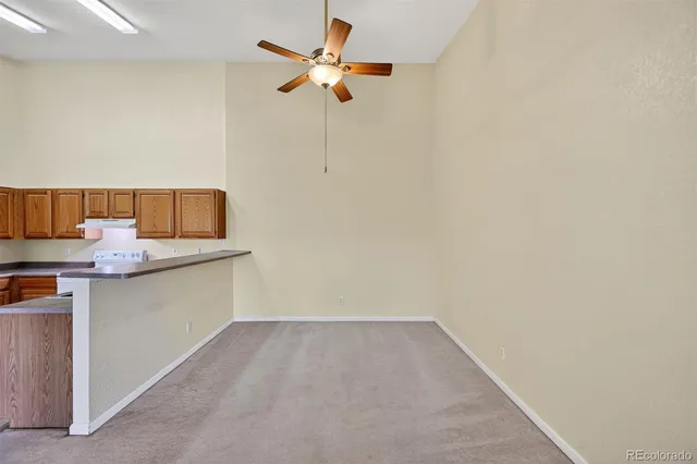 a very nice looking room with a fan