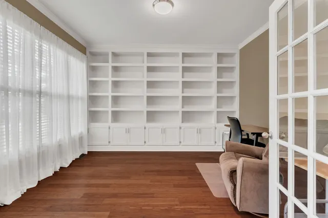 a view of livingroom with furniture and workspace
