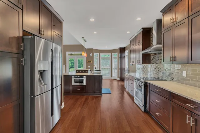 a kitchen with a table and chairs in it