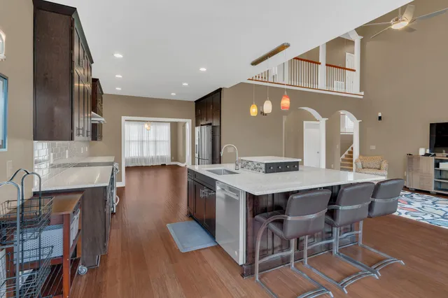 a kitchen with stainless steel appliances granite countertop a stove and a sink