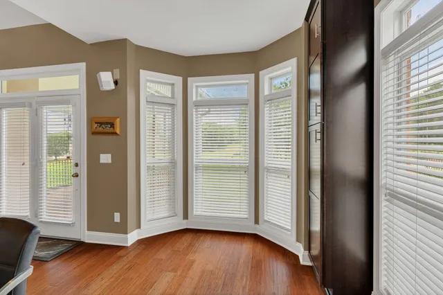 a living room with furniture fireplace and flat screen tv
