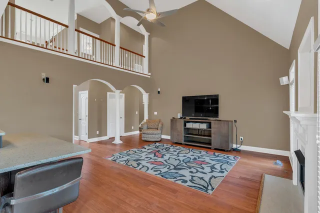 a view of an empty room with a ceiling fan