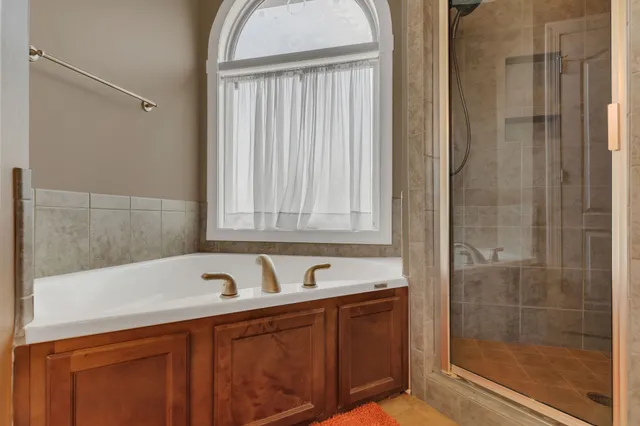 a bathroom with a sink mirror and vanity