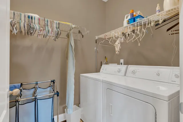 a view of a livingroom with a ceiling fan and window