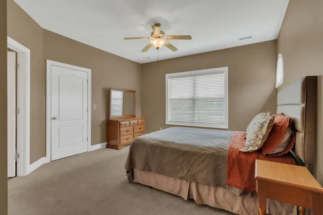a bathroom with a glass shower door and mirror