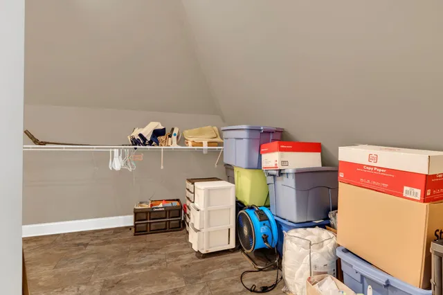 an empty room with fan and windows