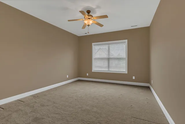 a view of staircase with railing and a painting