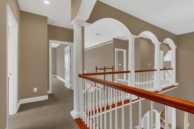 an aerial view of a house with outdoor space and lake view