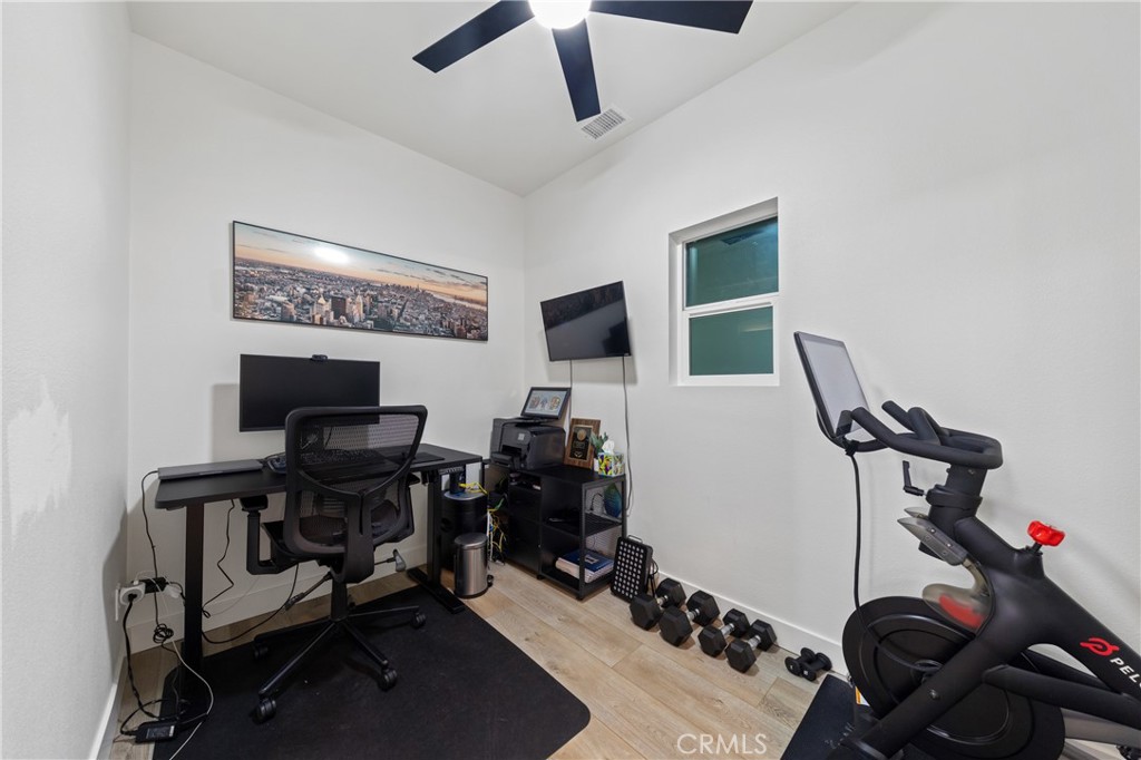 32985 Novara Court Temecula, CA 92592 - Photo 42 of 56 Dedicated Home Gym Or Office Space With Modern Ceiling Fan And Flexible Use Options