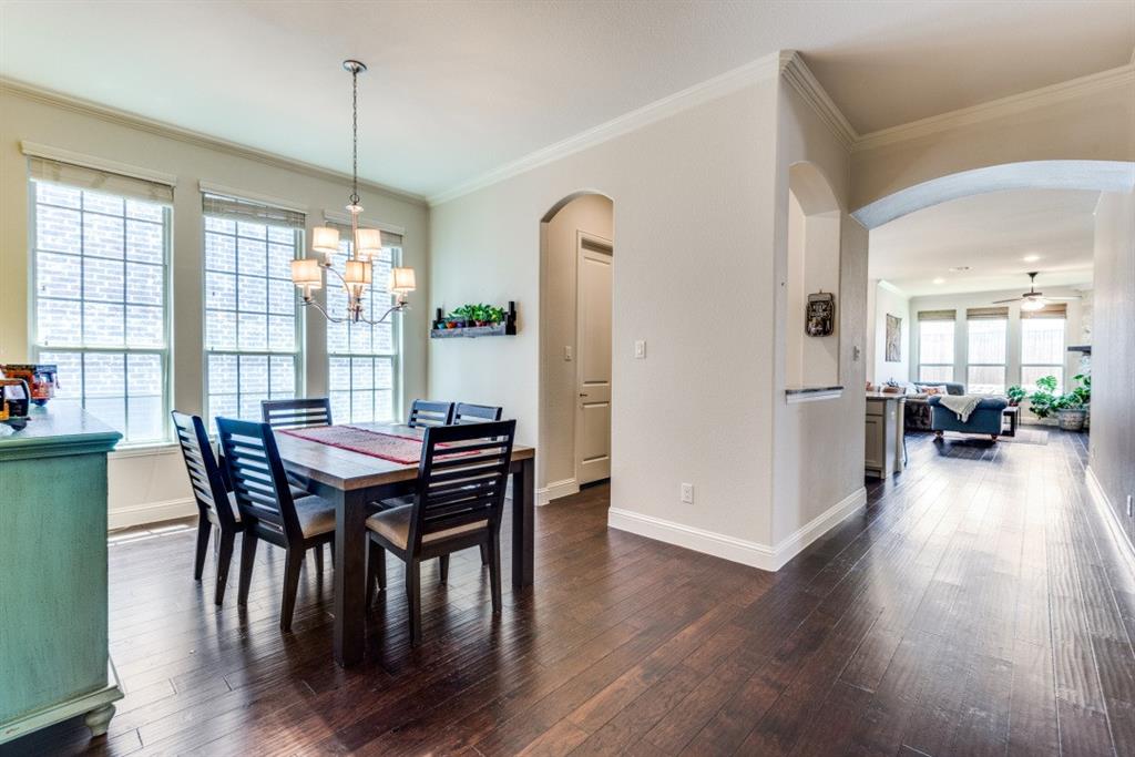 2364 Mare Road Carrollton, TX 75010 - Photo 11 of 25 a view of a dining room with furniture window and wooden floor