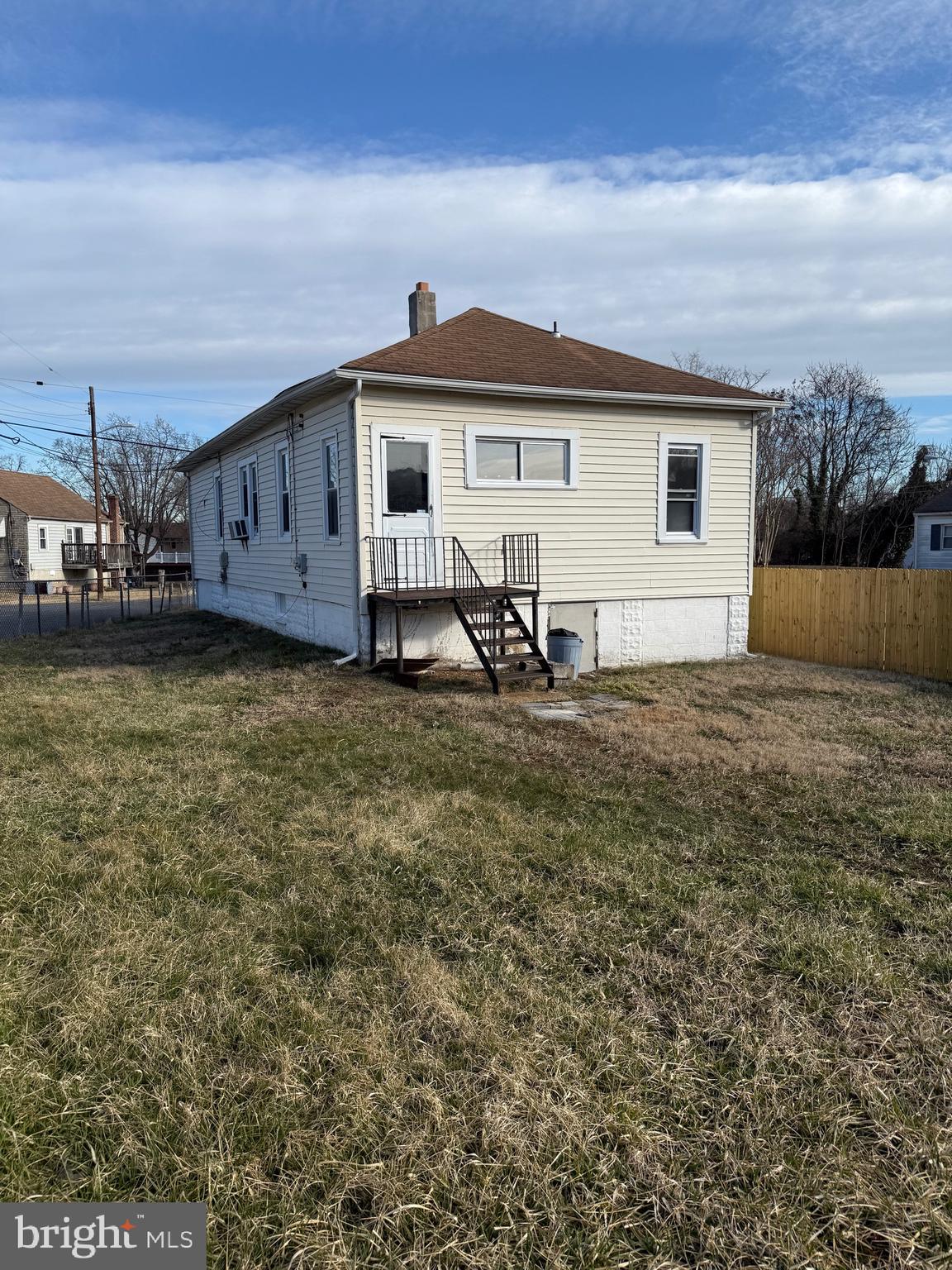 239 Midland Brooklyn, MD 21225 - Photo 11 of 13 a view of a house with a patio
