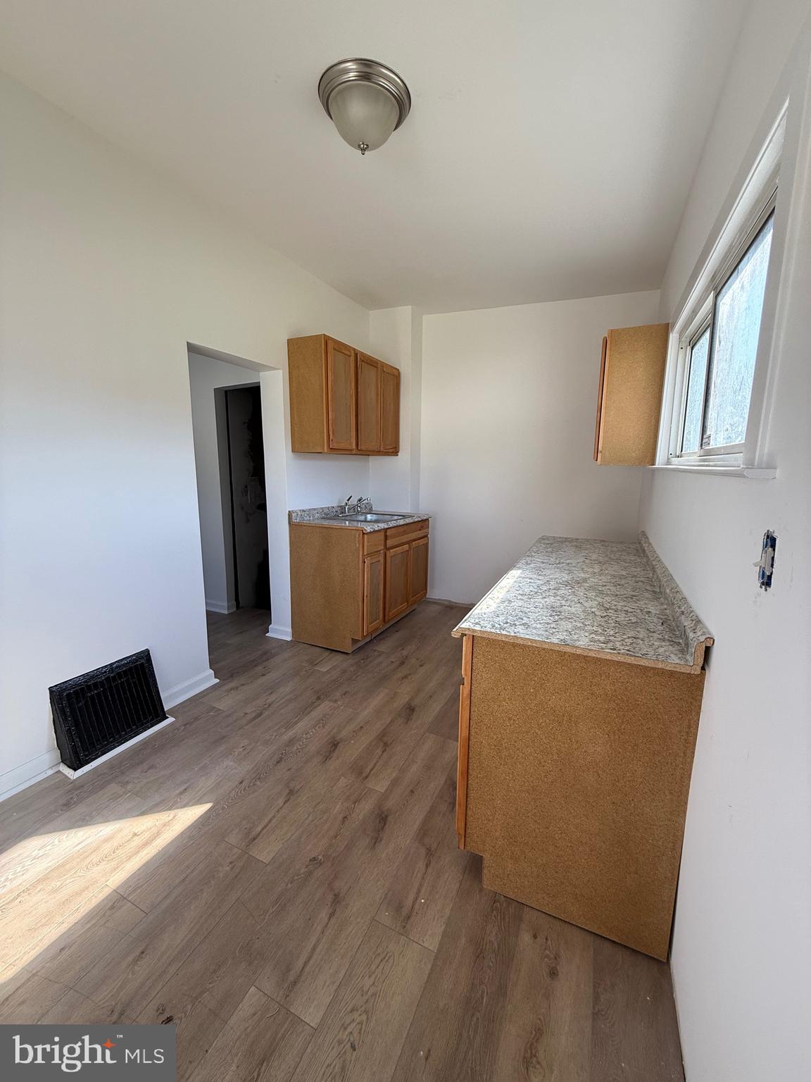 239 Midland Brooklyn, MD 21225 - Photo 5 of 13 a bedroom with a bed and a television