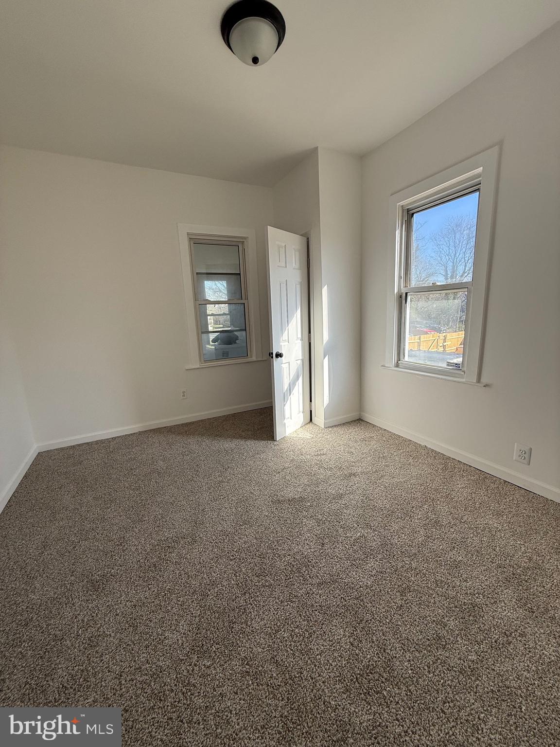 239 Midland Brooklyn, MD 21225 - Photo 6 of 13 an empty room with windows