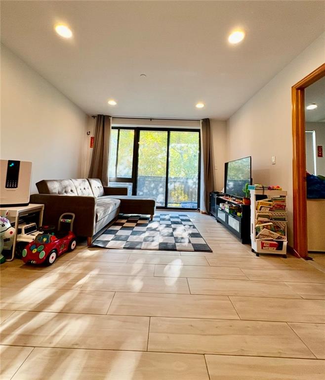 229 55th Street, Unit 3A Brooklyn, NY 11220 - Photo 2 of 10 a view of a room with gym equipment