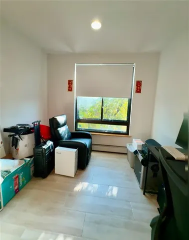 a view of a workspace with furniture and a gate