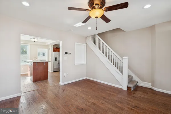 a view of an entryway with wooden floor