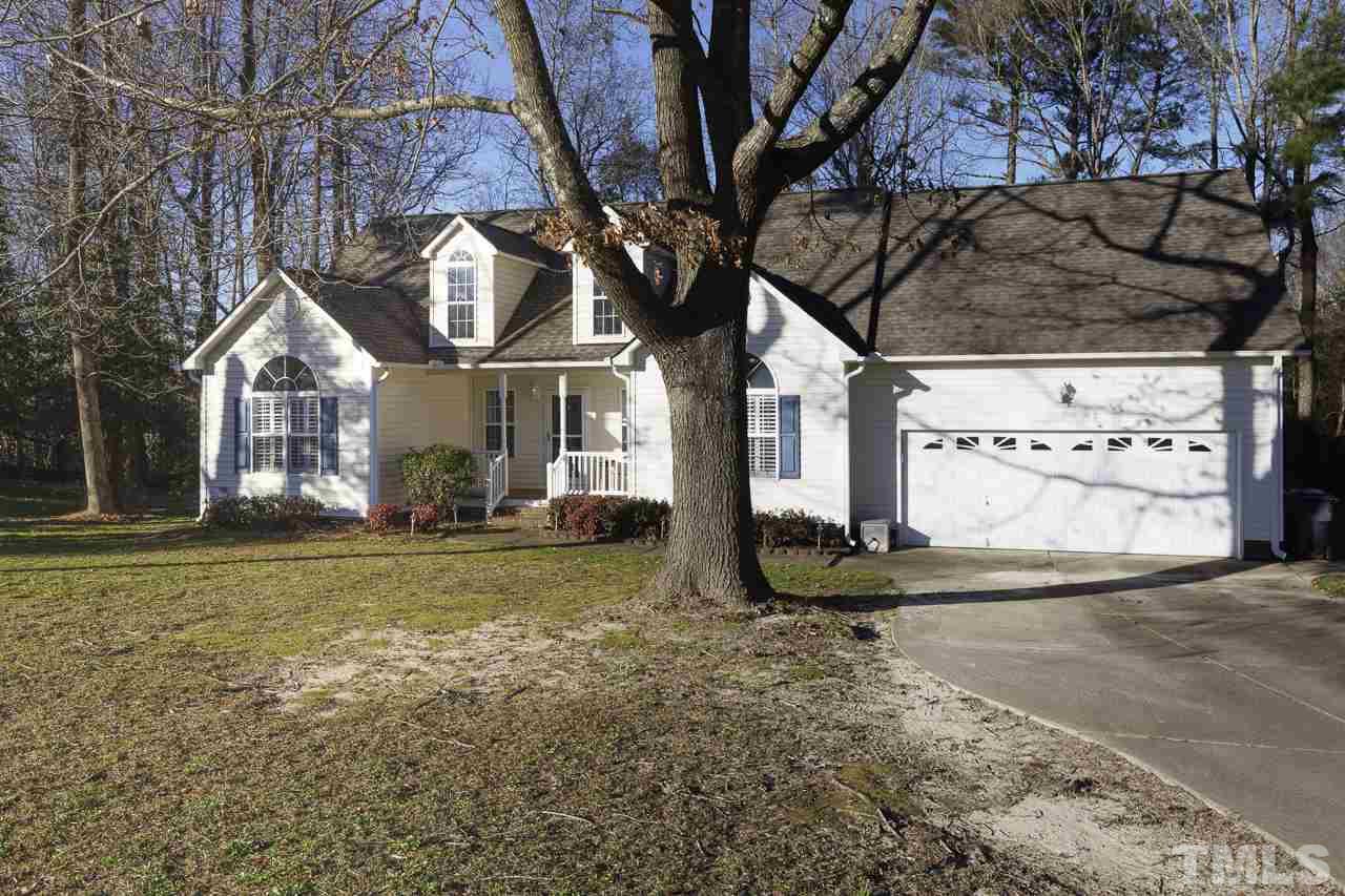 247 Cross Ridge Drive Willow Spring, NC 27592 - Photo 3 of 25 a front view of a house with a yard